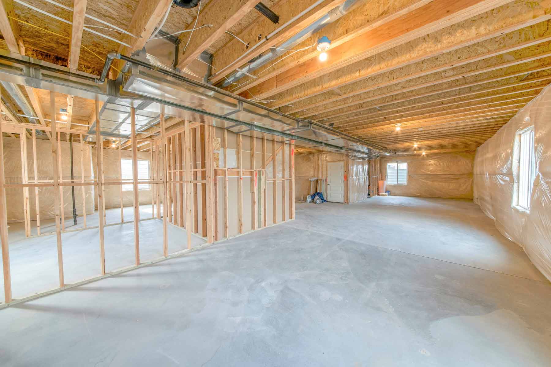 Basement partition framing and lower-level mechanical layout