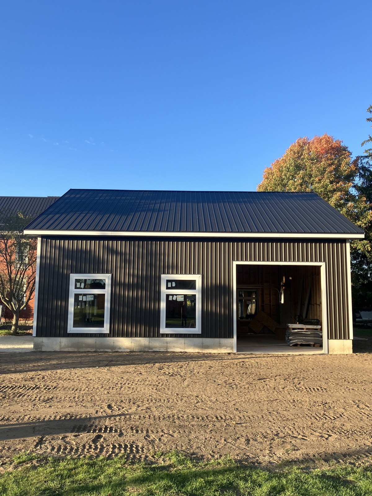 Black detached garage and shop front elevation