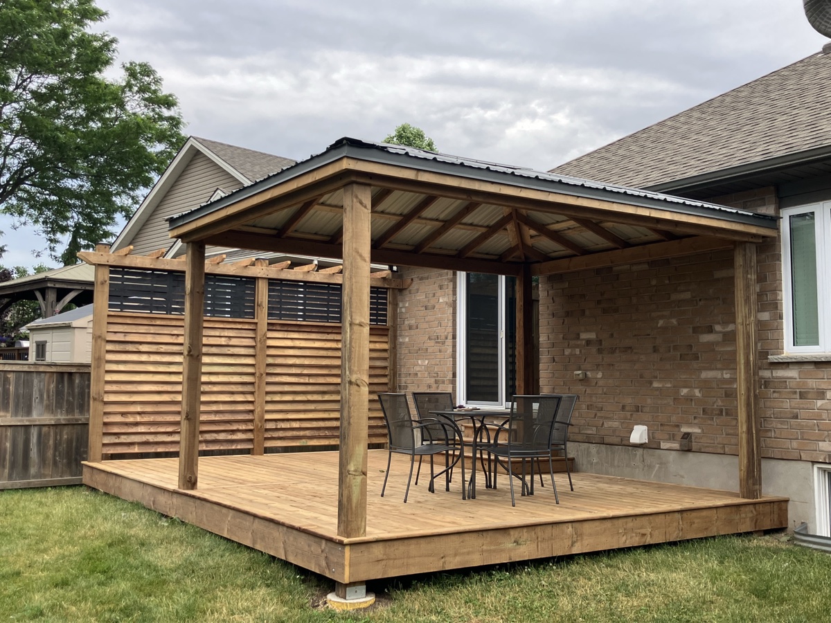Covered outdoor deck structure by Cutting Edge Carpentry