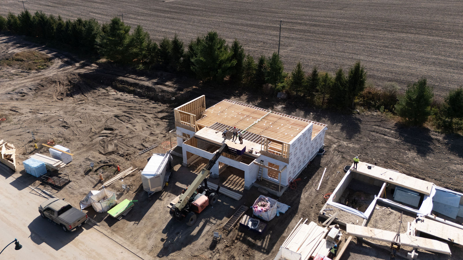 Drone photo of a residential construction jobsite and framing work