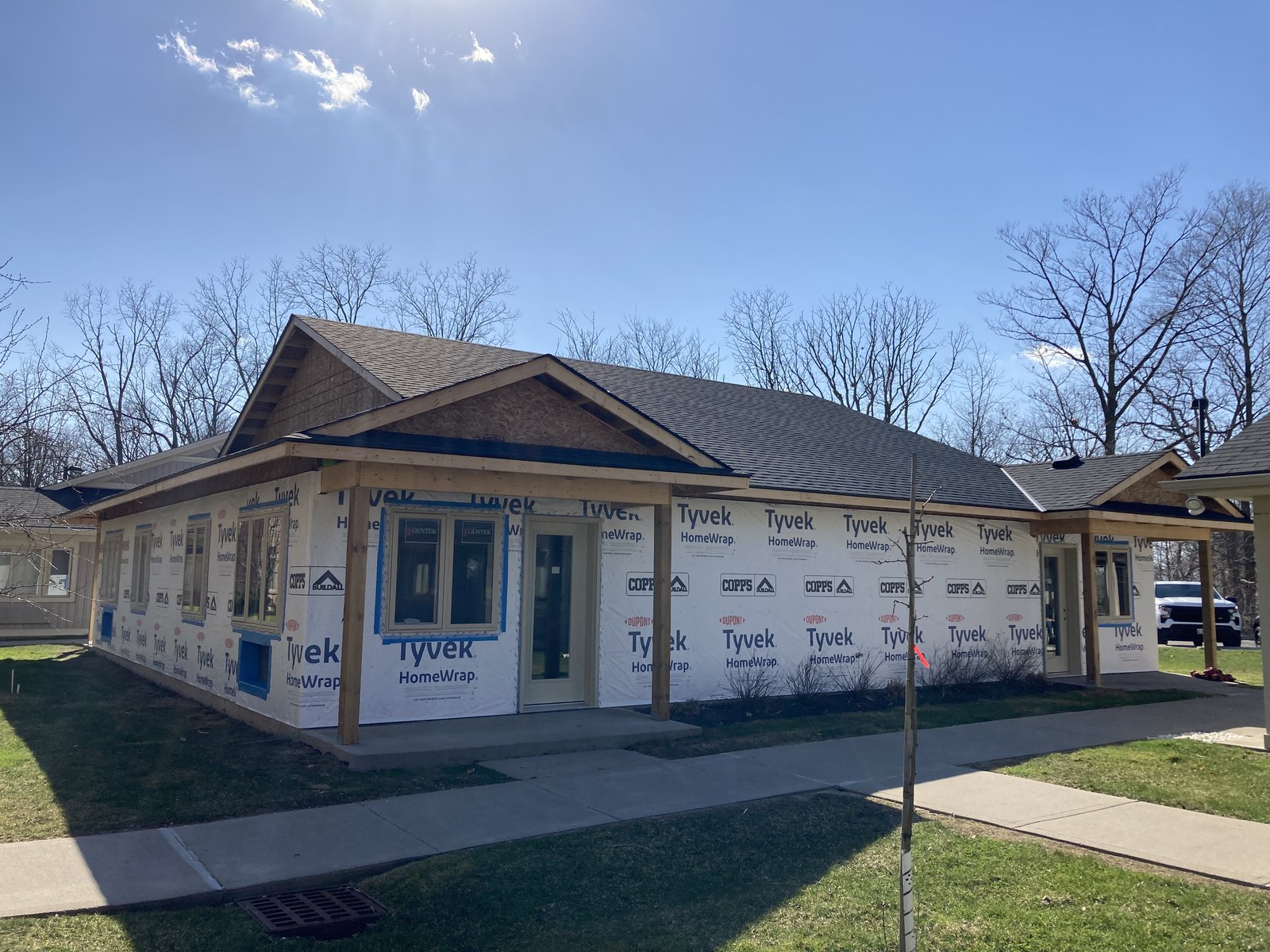 Custom home exterior wall framing and house wrap from the side elevation