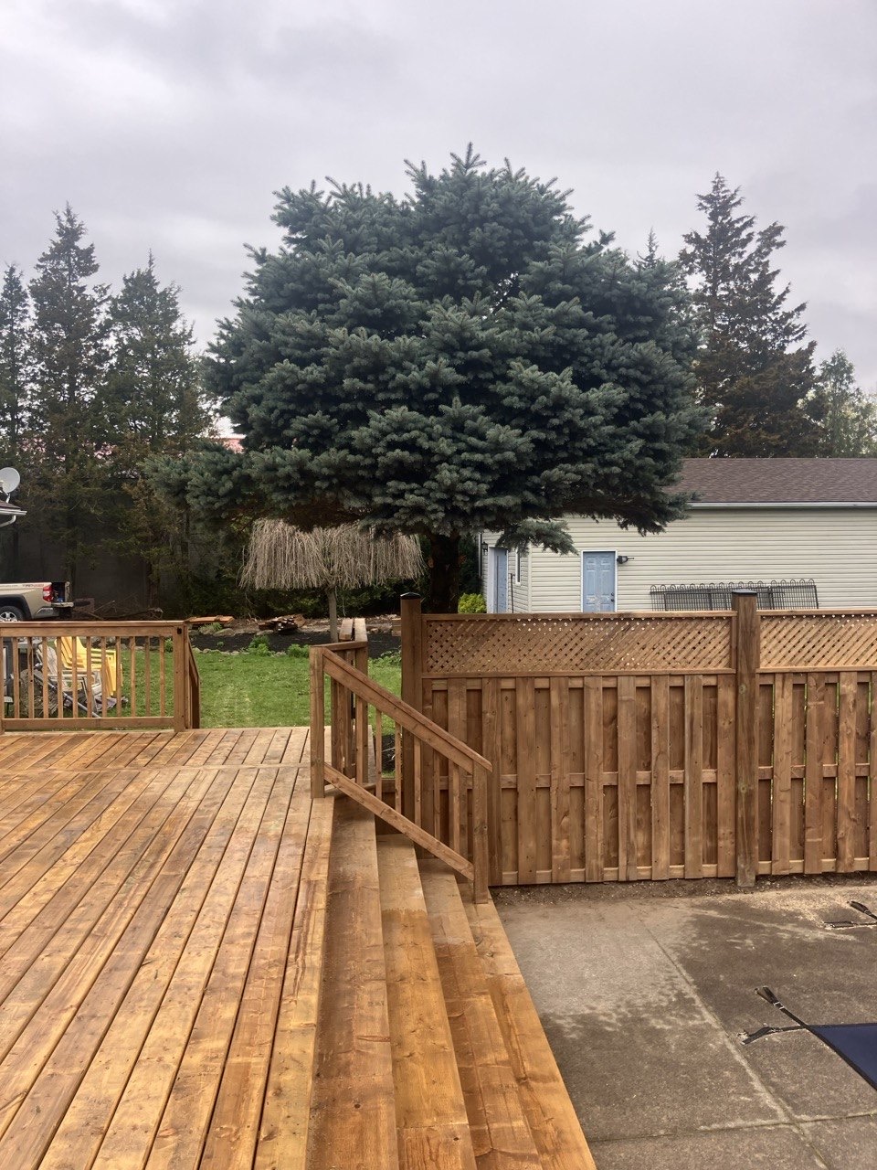 Deck stairs and railing detail by Cutting Edge Carpentry