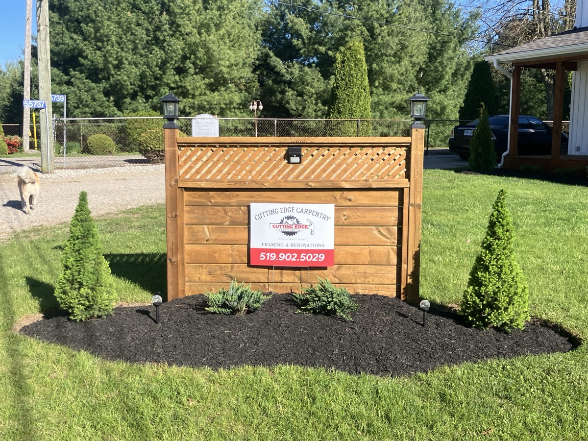 Cutting Edge Carpentry fence project and yard sign near Straffordville